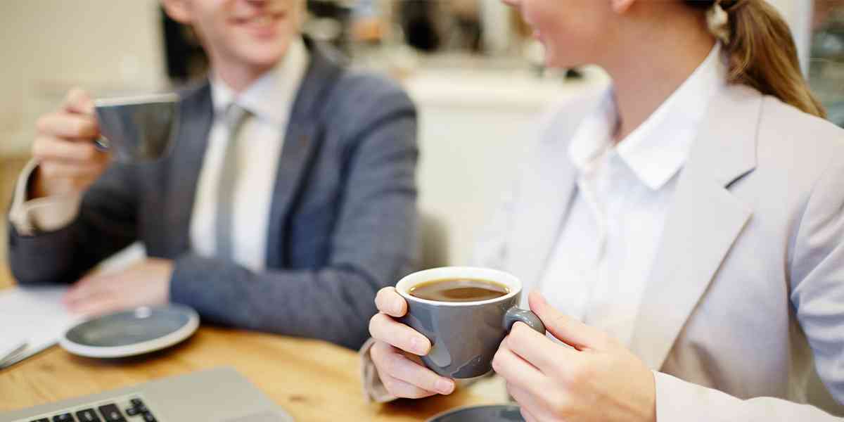 office staff enjoying a cup of coffee
