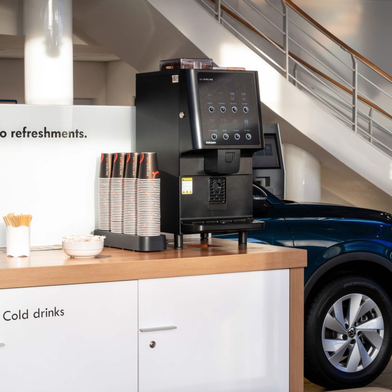 Coffee machine in automotive car showroom