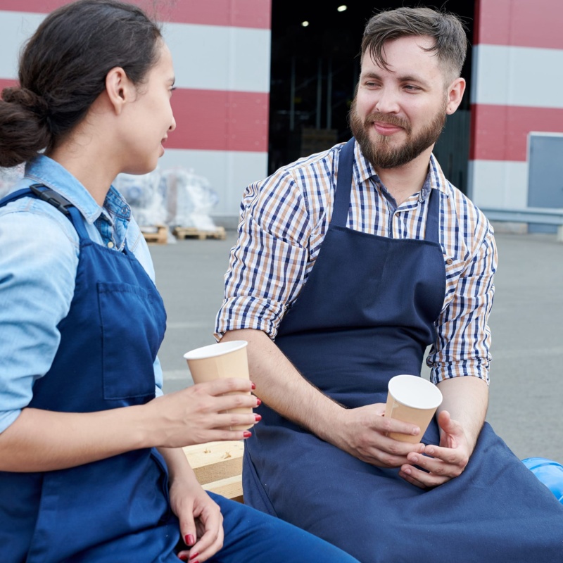 Two shift workers on break enjoying coffee