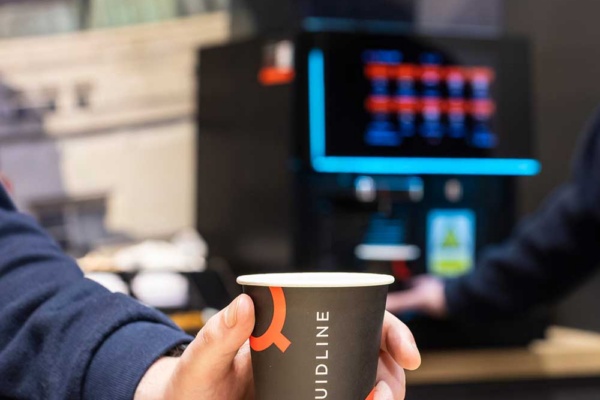 hand holding cup of coffee