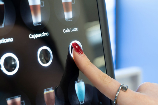 Q1 Powdered Milk Machine - Finger selecting drink