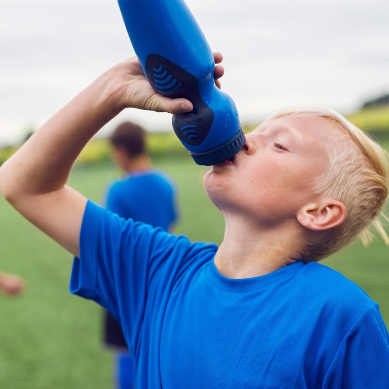 Child drinking from sports water bottle