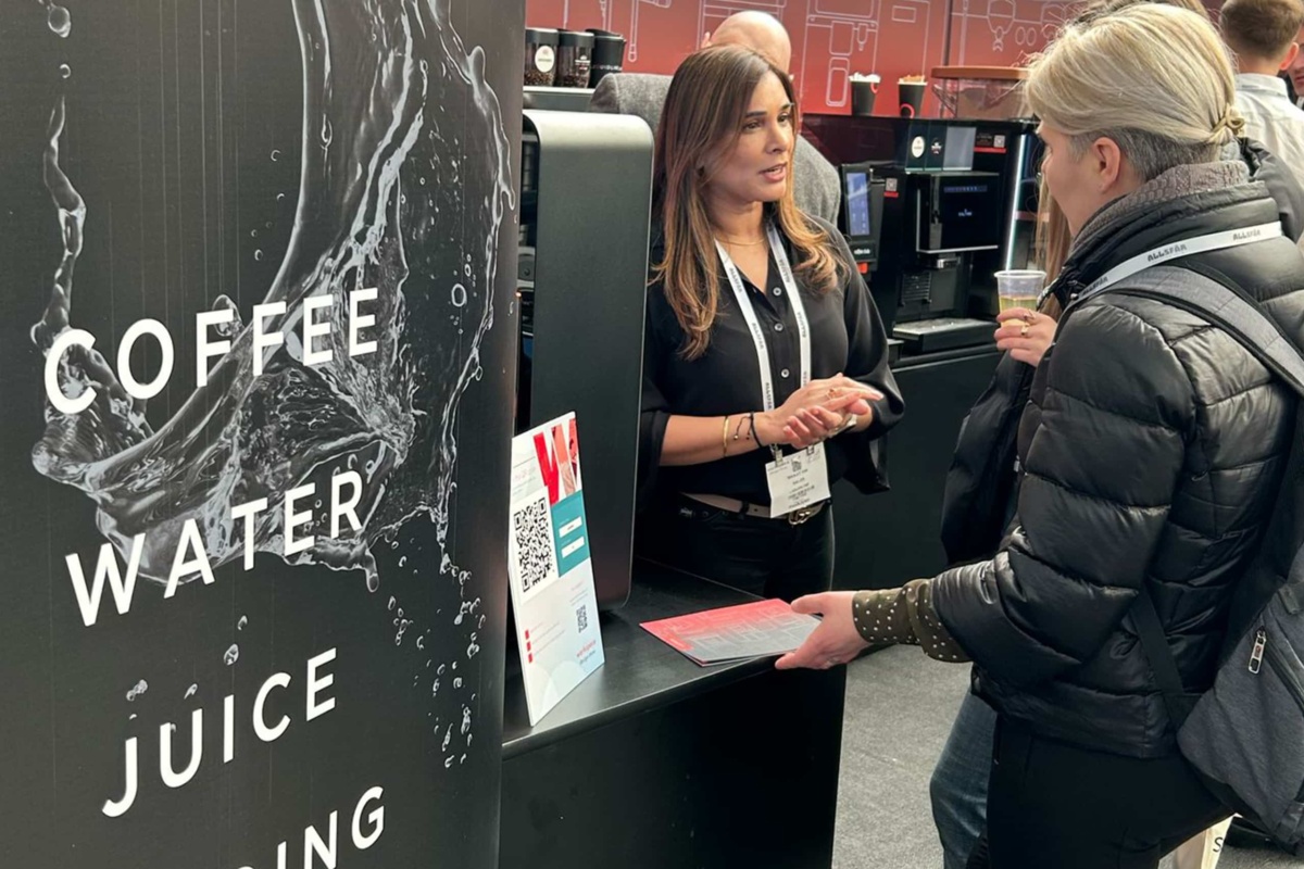exhibition staff talking to customers at a show