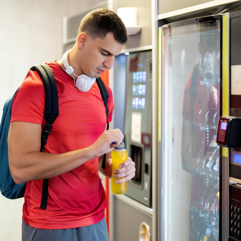 Person opening juice from leisure vending machine