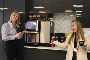 Two Liquidline staff at coffee machine