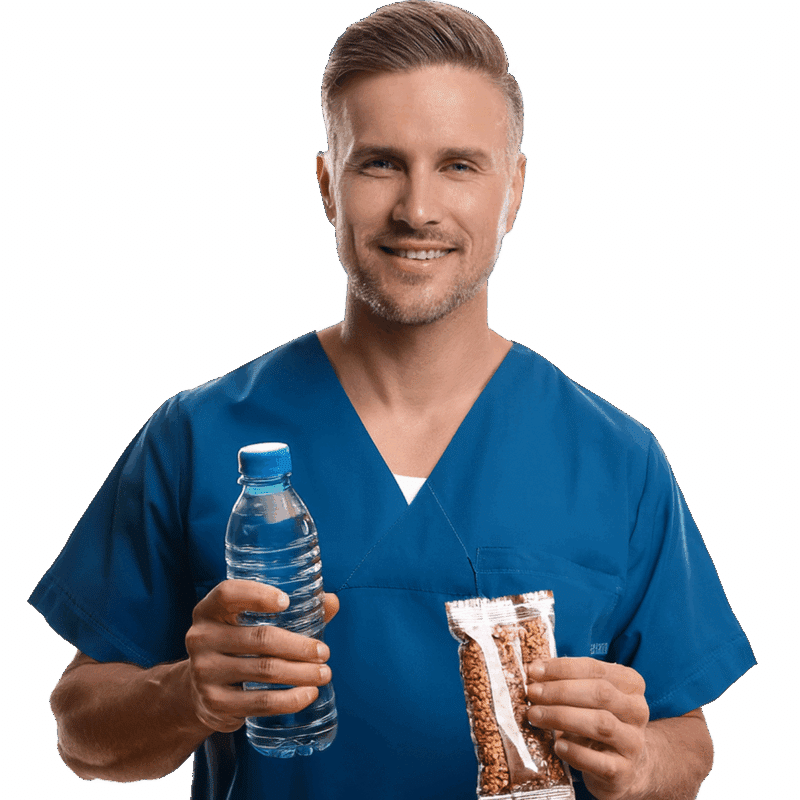 Healthcare worker with a bottle of water and snack in hand