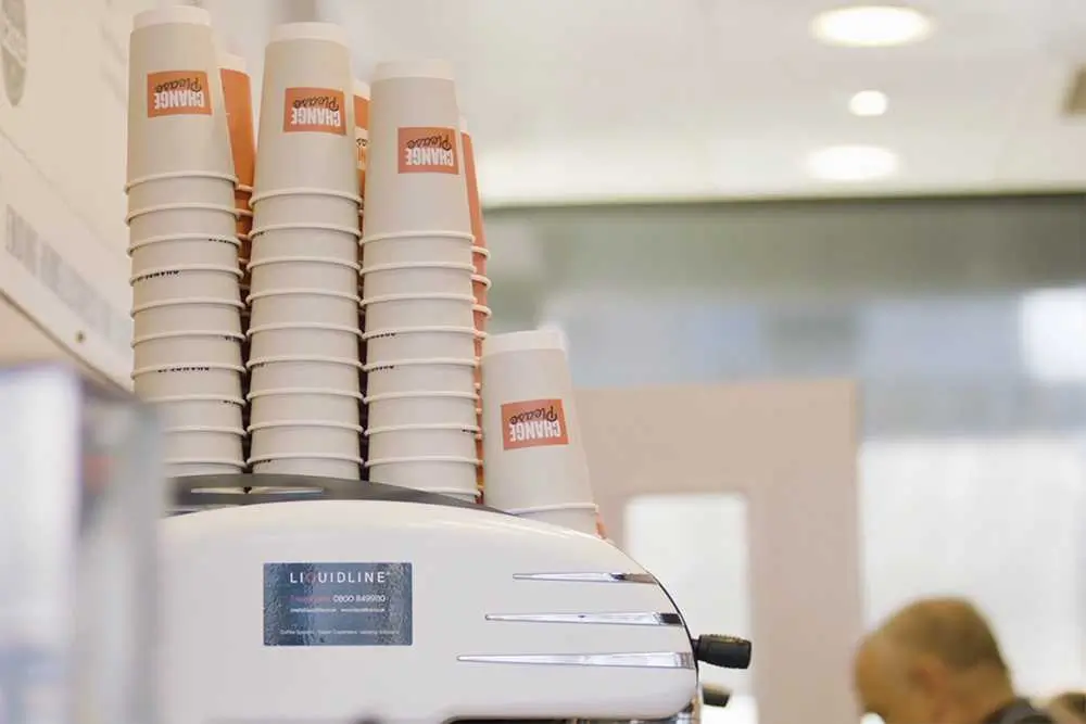 Change Please branded paper cups