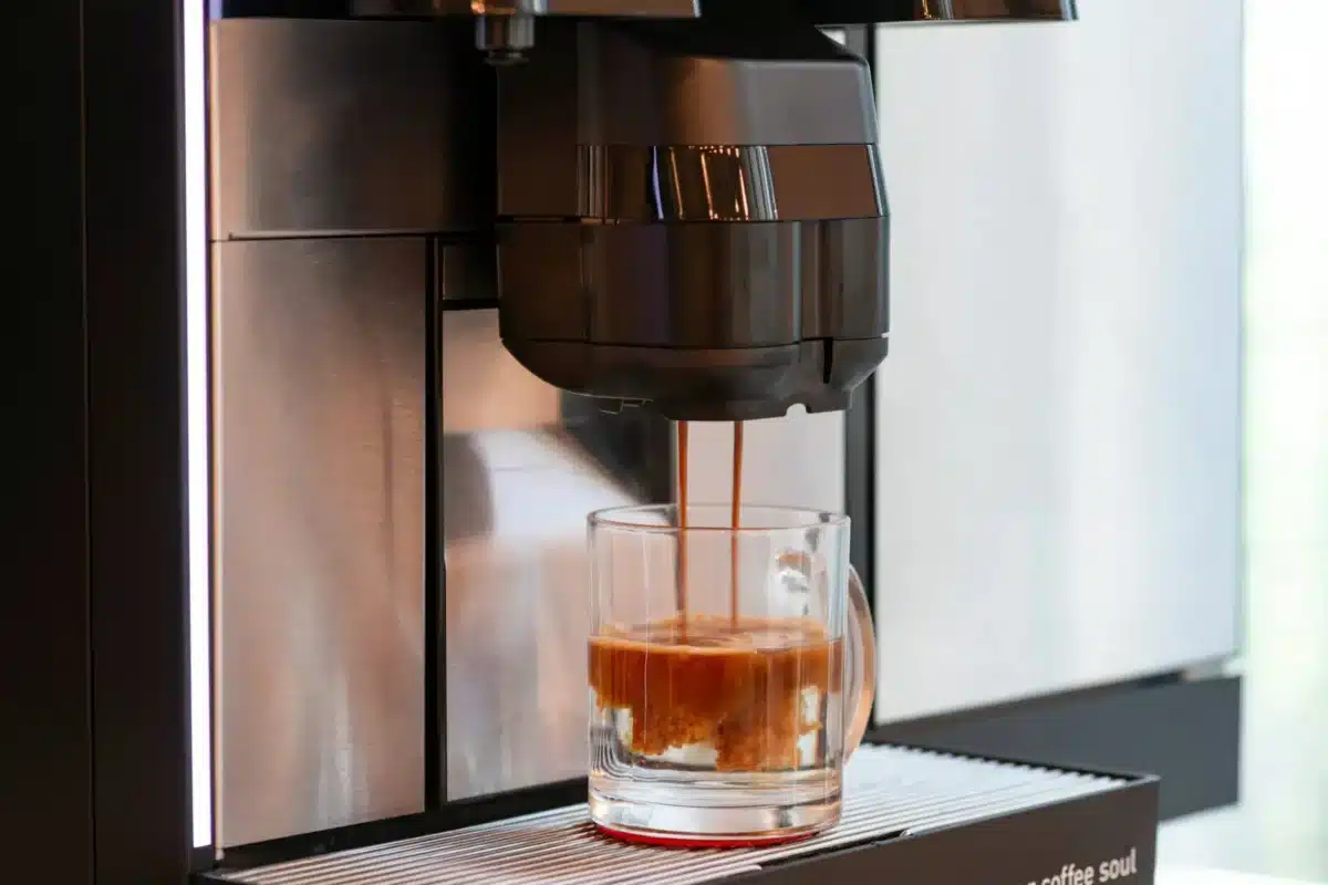 Coffee cup being filled by machine