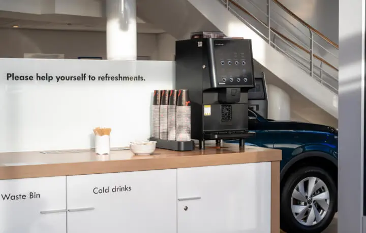 Coffee machine in car showroom