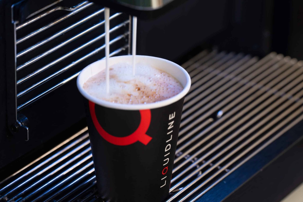 Liquidline coffee cup being filled from machine