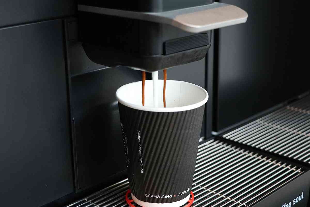 coffee cup being filled with coffee