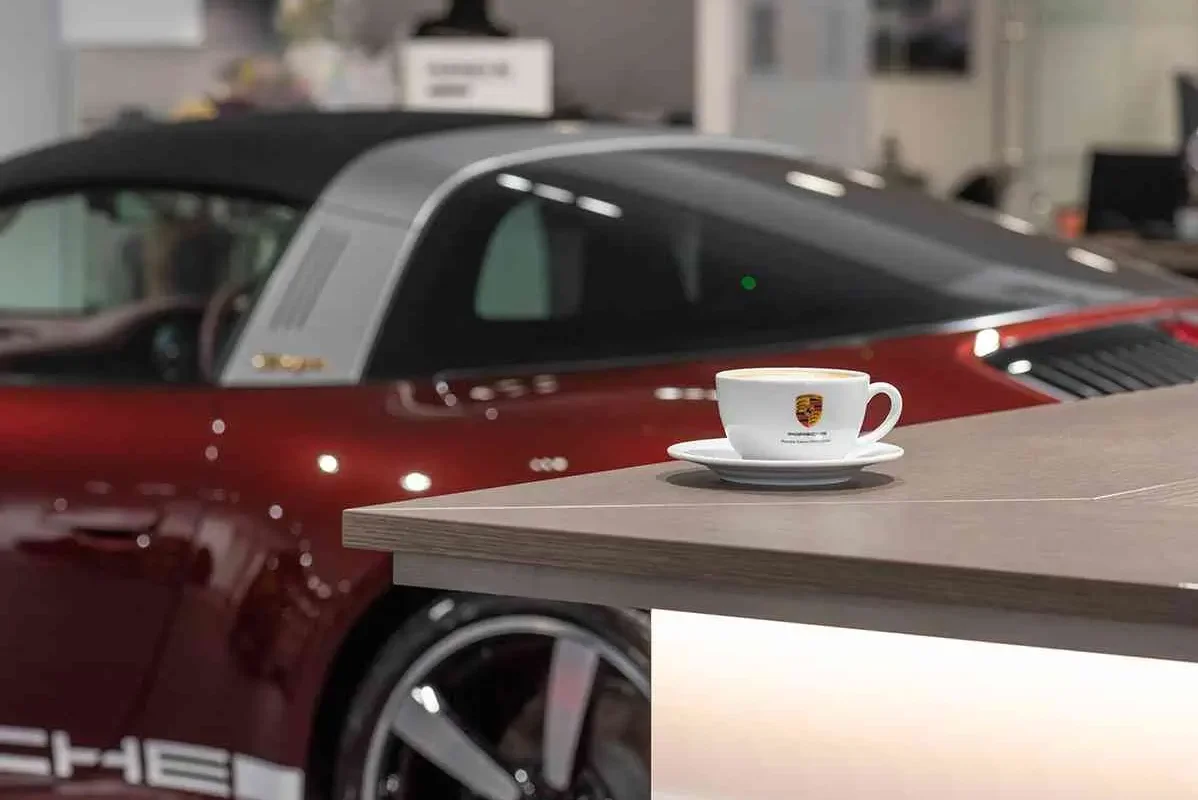 coffee cup inside porsche west london showroom