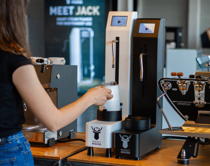 Barista using a Perfect Moose Jack Milk Steamer