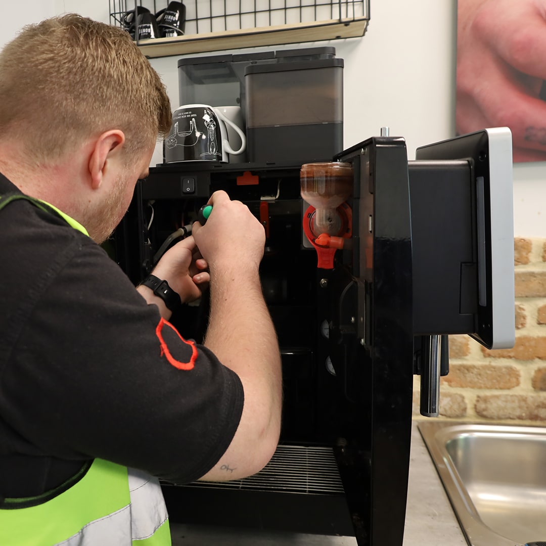 engineer repairing coffee machine