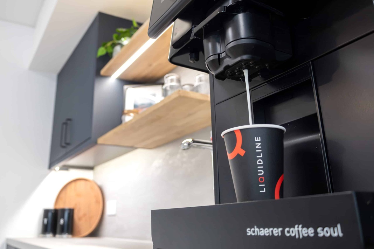 liquidline cup being filled from a schaerer coffee machine