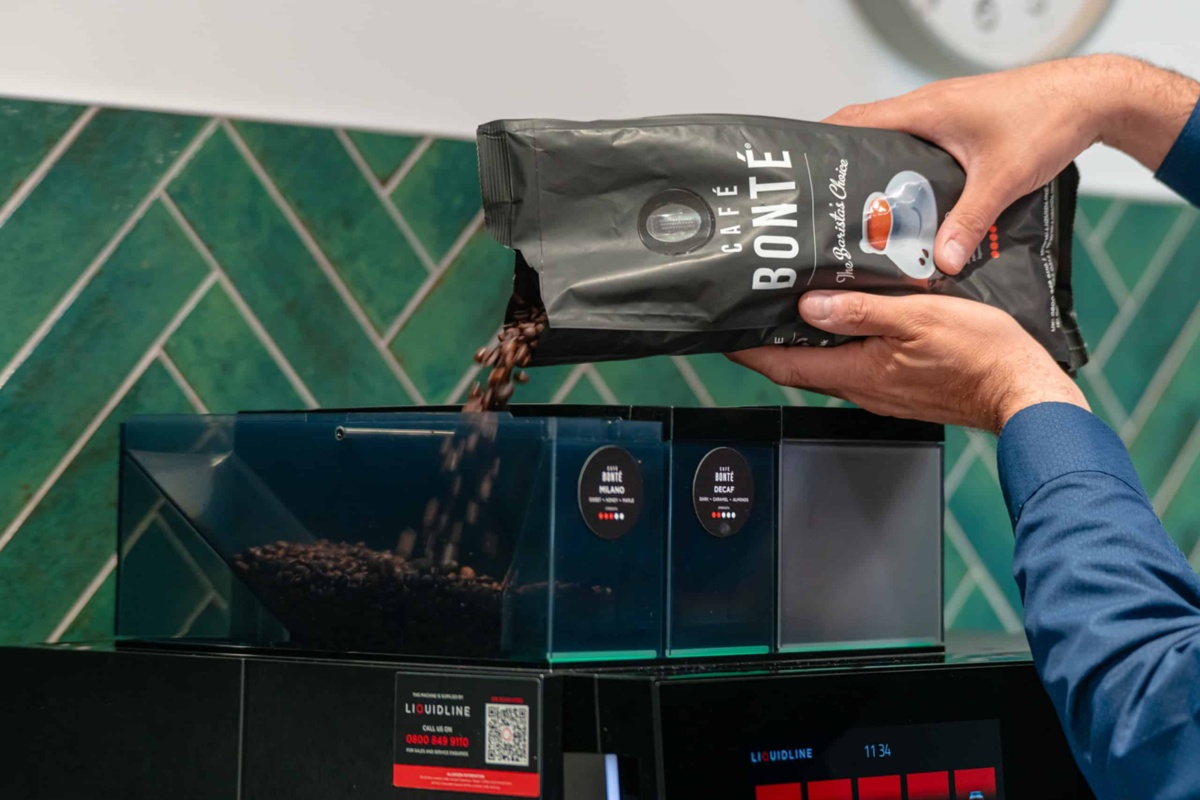 Liquidline coffee beans being poured into hopper