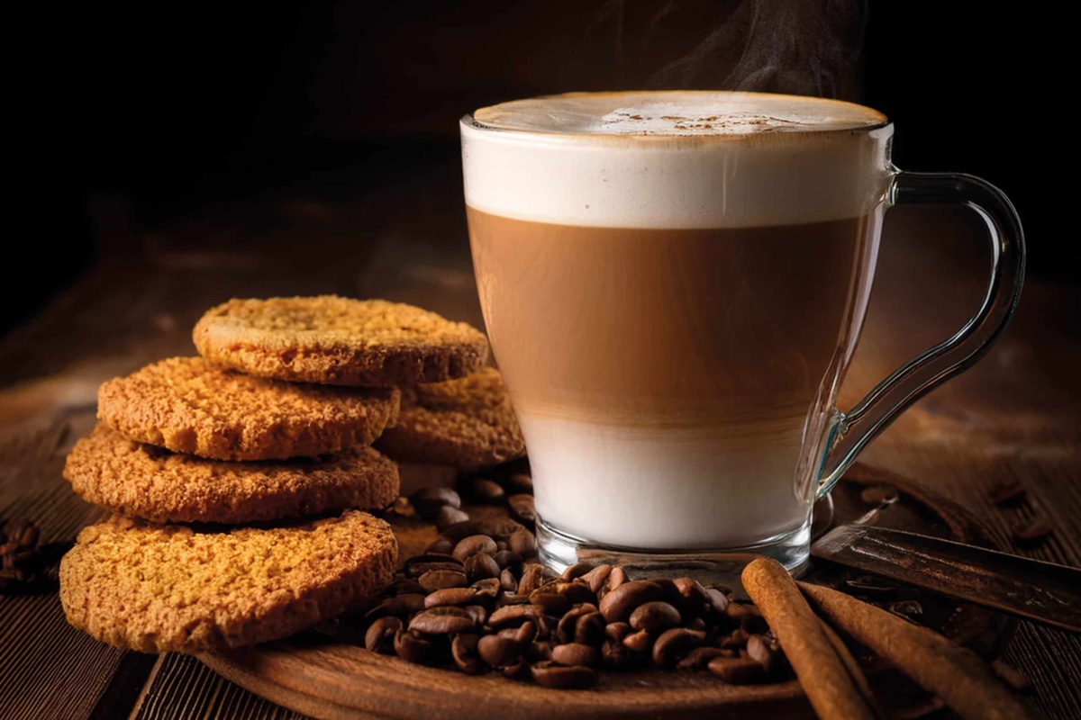 Glass coffee cup full with biscuits