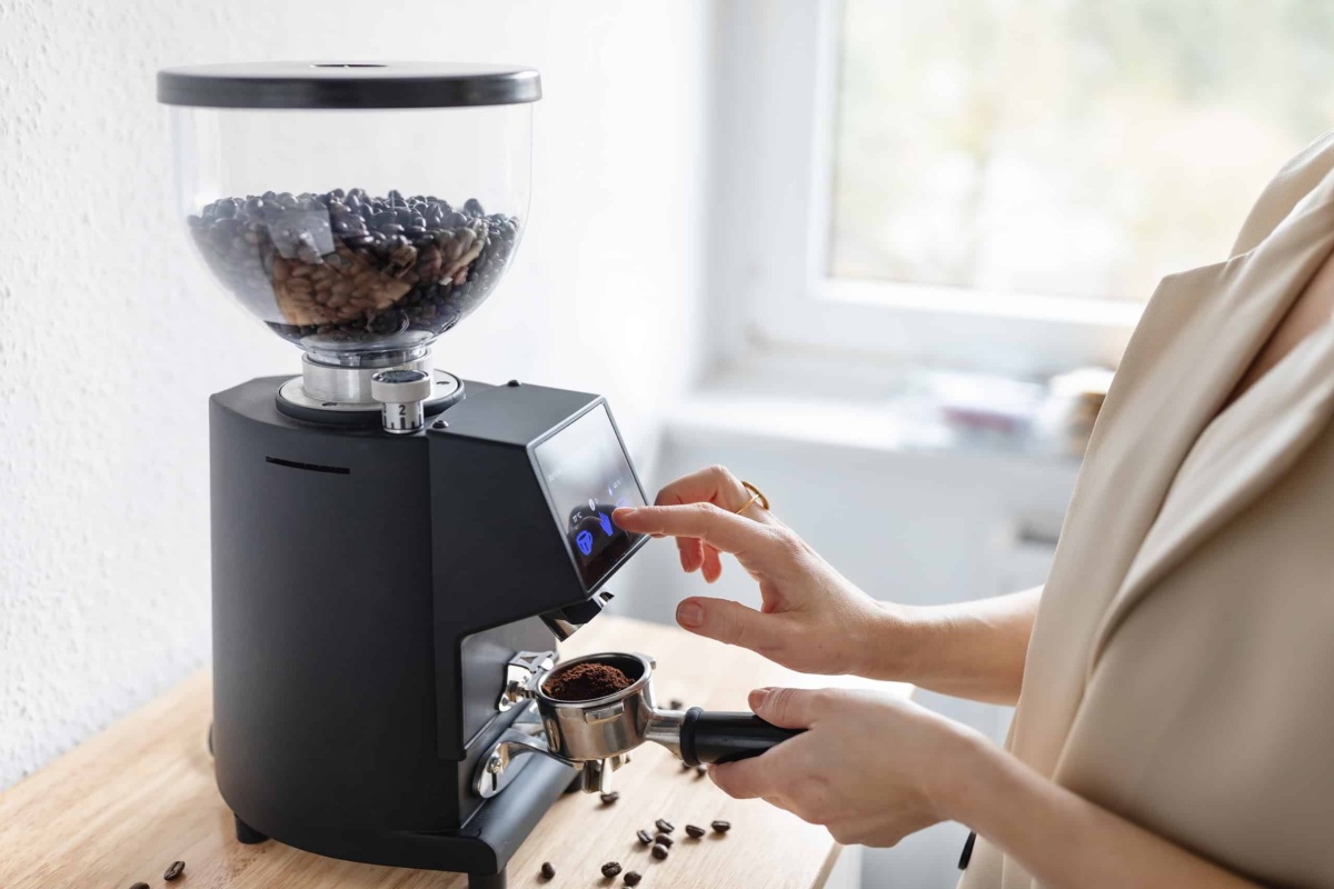 Coffee grinder machine being used