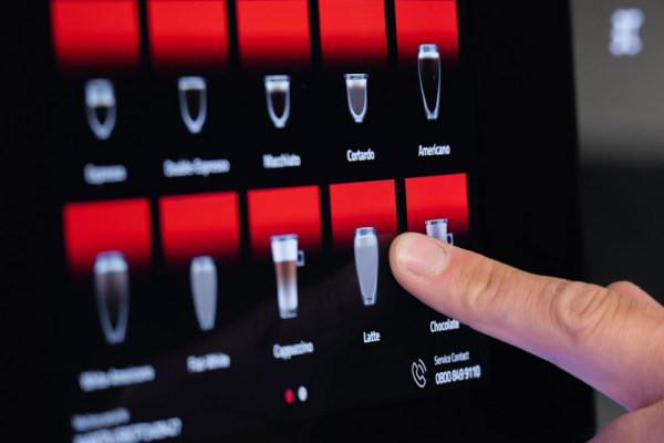 K2 fresh milk machine, hand selecting drink option