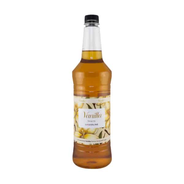 A clear plastic bottle filled with a delicious golden-brown vanilla syrup, featuring a label decorated with vanilla flowers and the text “Vanilla Syrup by Liquidline.” The bottle has a black cap and is photographed against a white background.