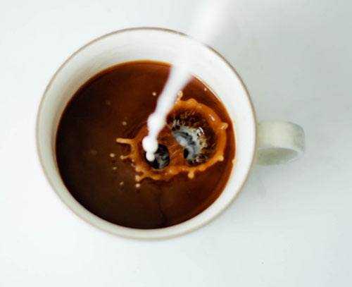 coffee with milk being poured