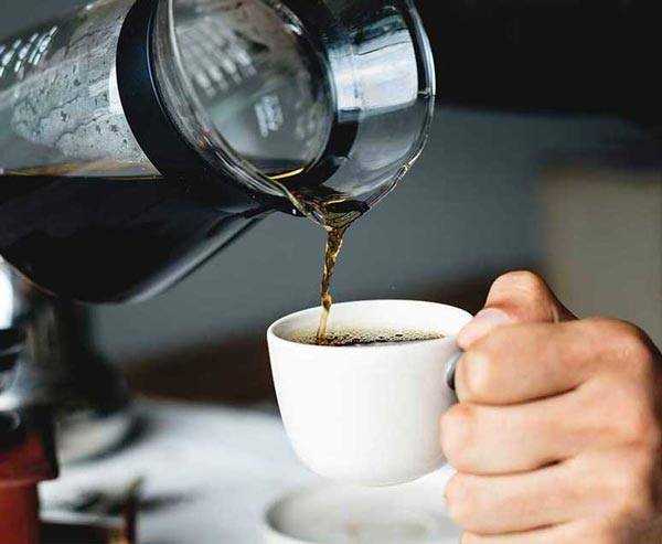 filter coffee being poured in a mug