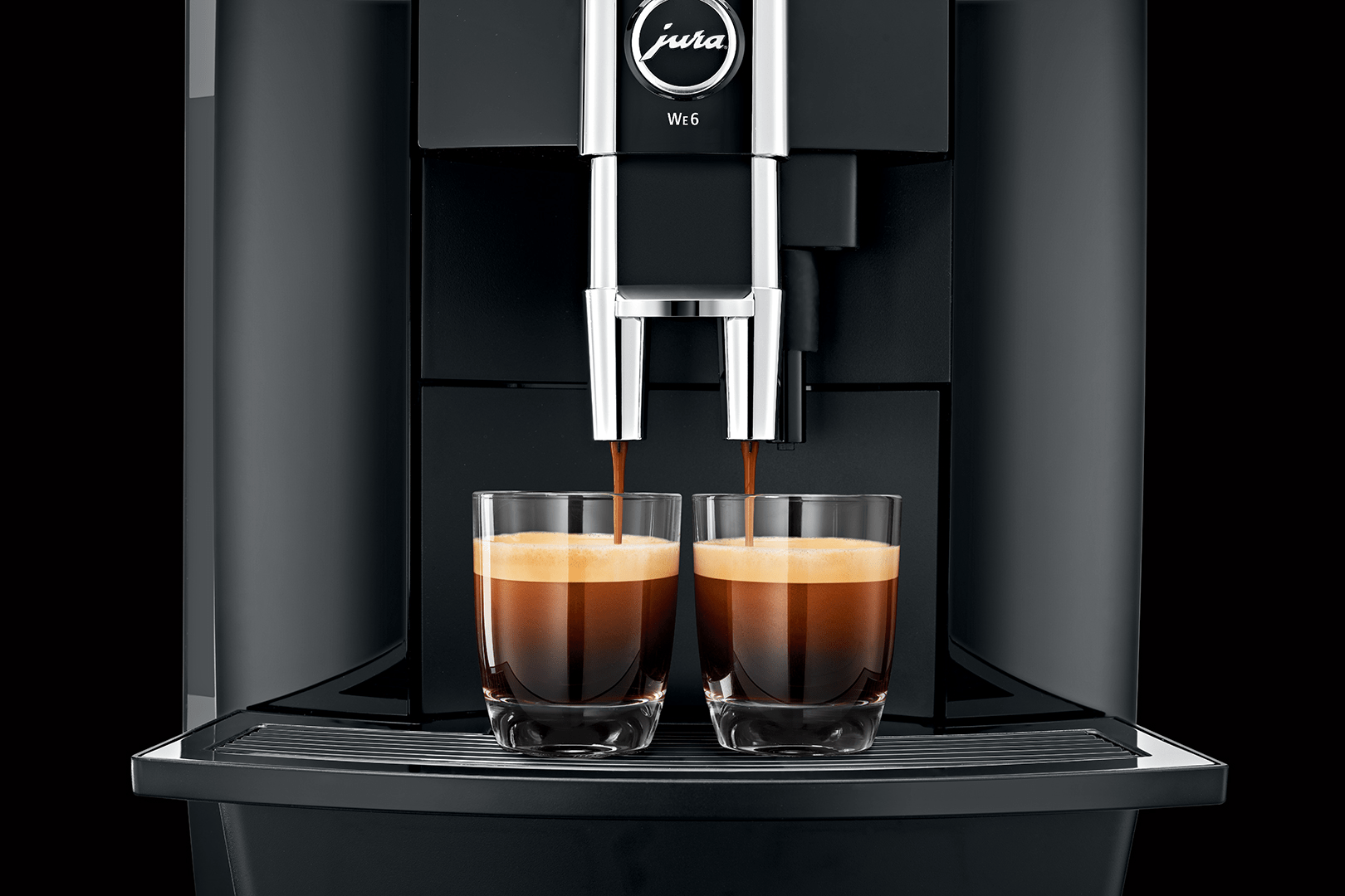 Close up of Jura coffee machine pouring two espressos