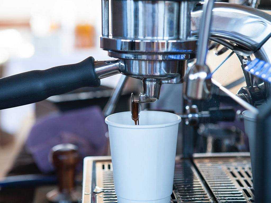 traditional machine dispensing coffee