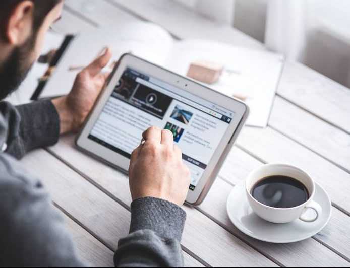 man reading a news article