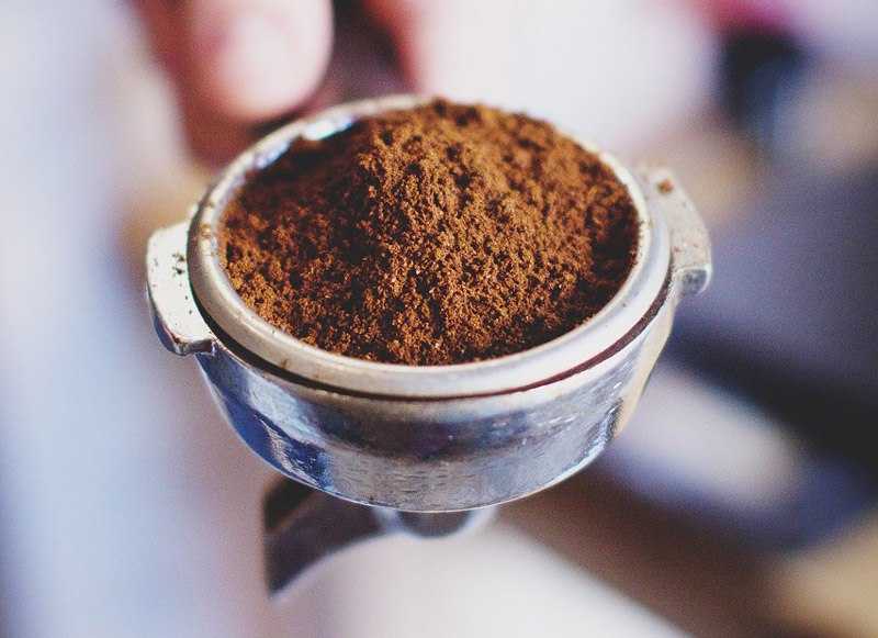 ground coffee in an espresso machine group head