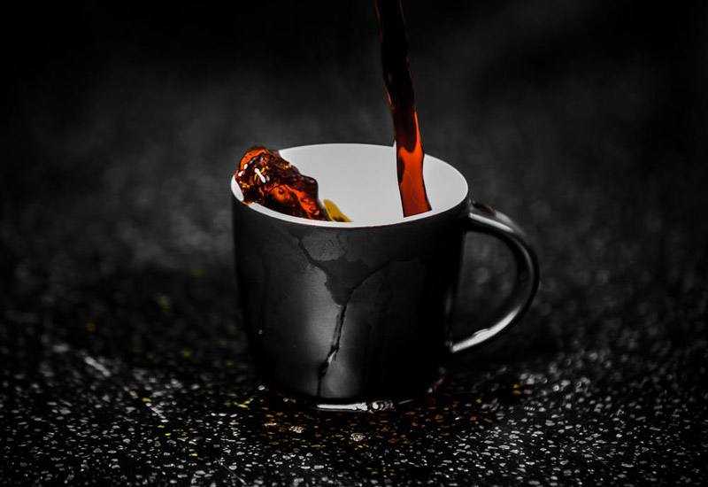 coffee pouring into black mug