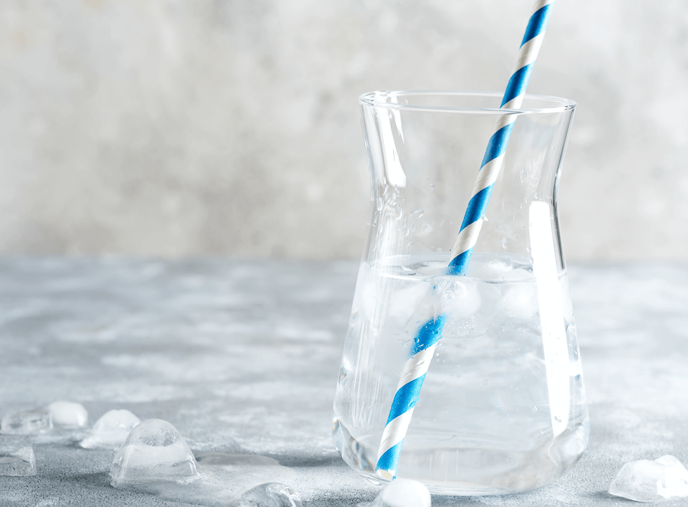 Jug of Brita filtered water with blue and white straw