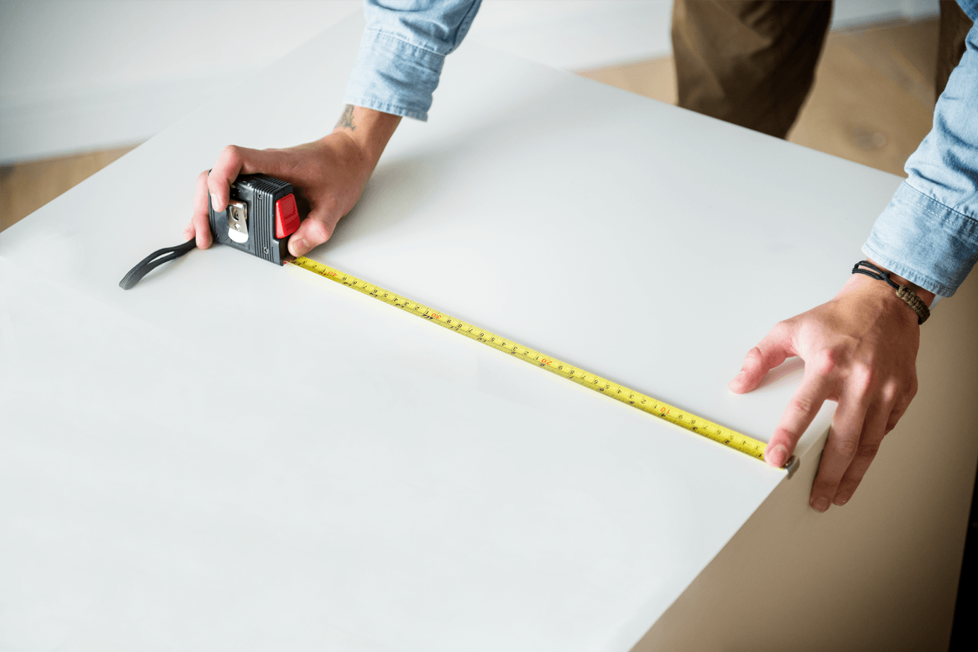 Man measuring with a tape measure