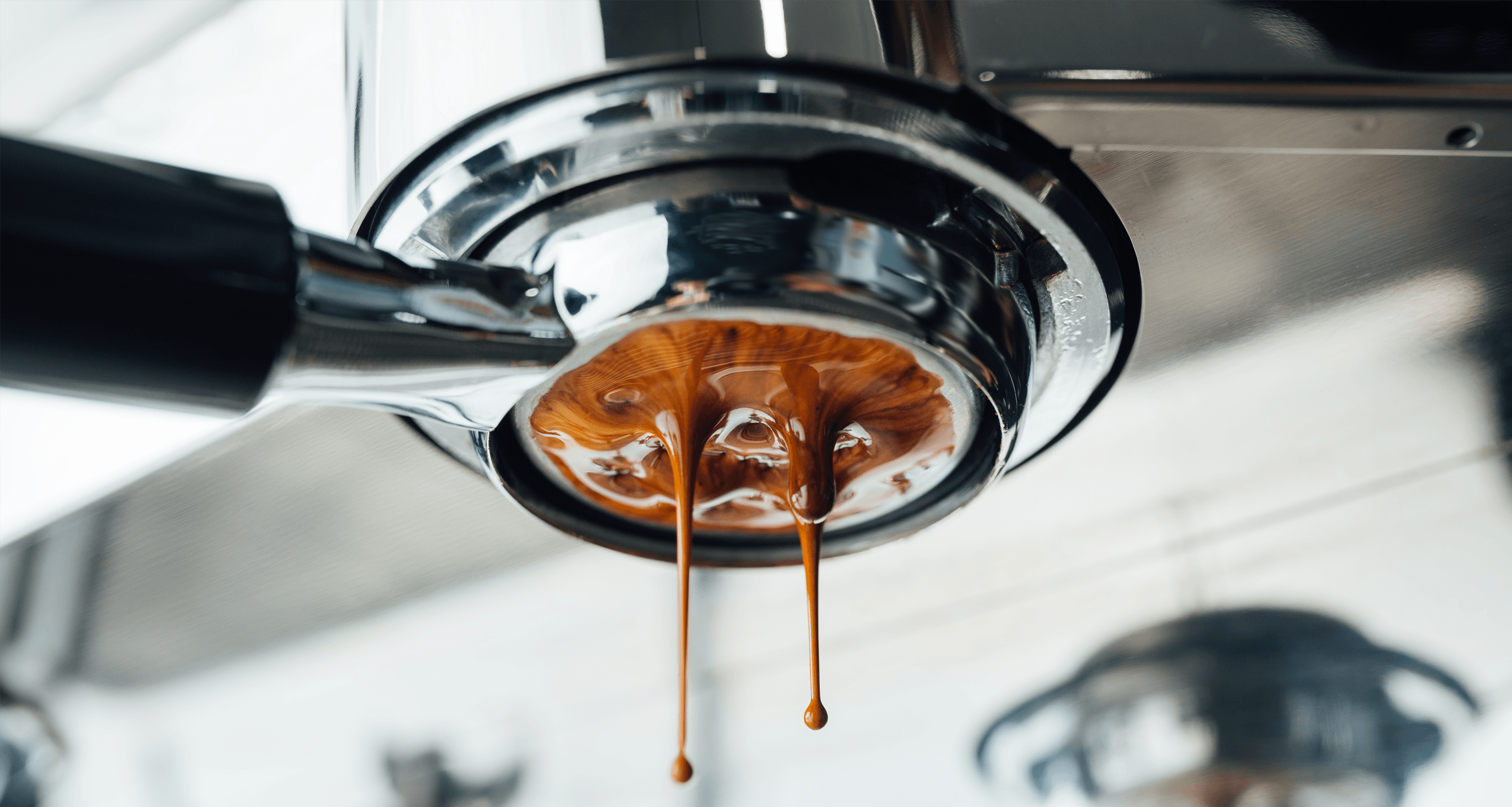 Coffee being extracted from coffee machine