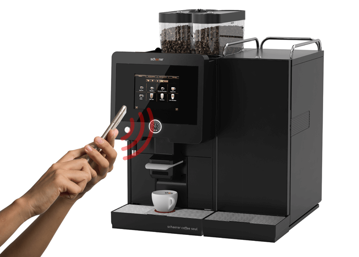 Person operating Schaerer Soul coffee machine from smartphone