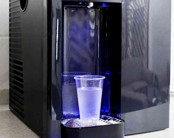 plastic cup with cold water from the L4 Liquidline water dispenser